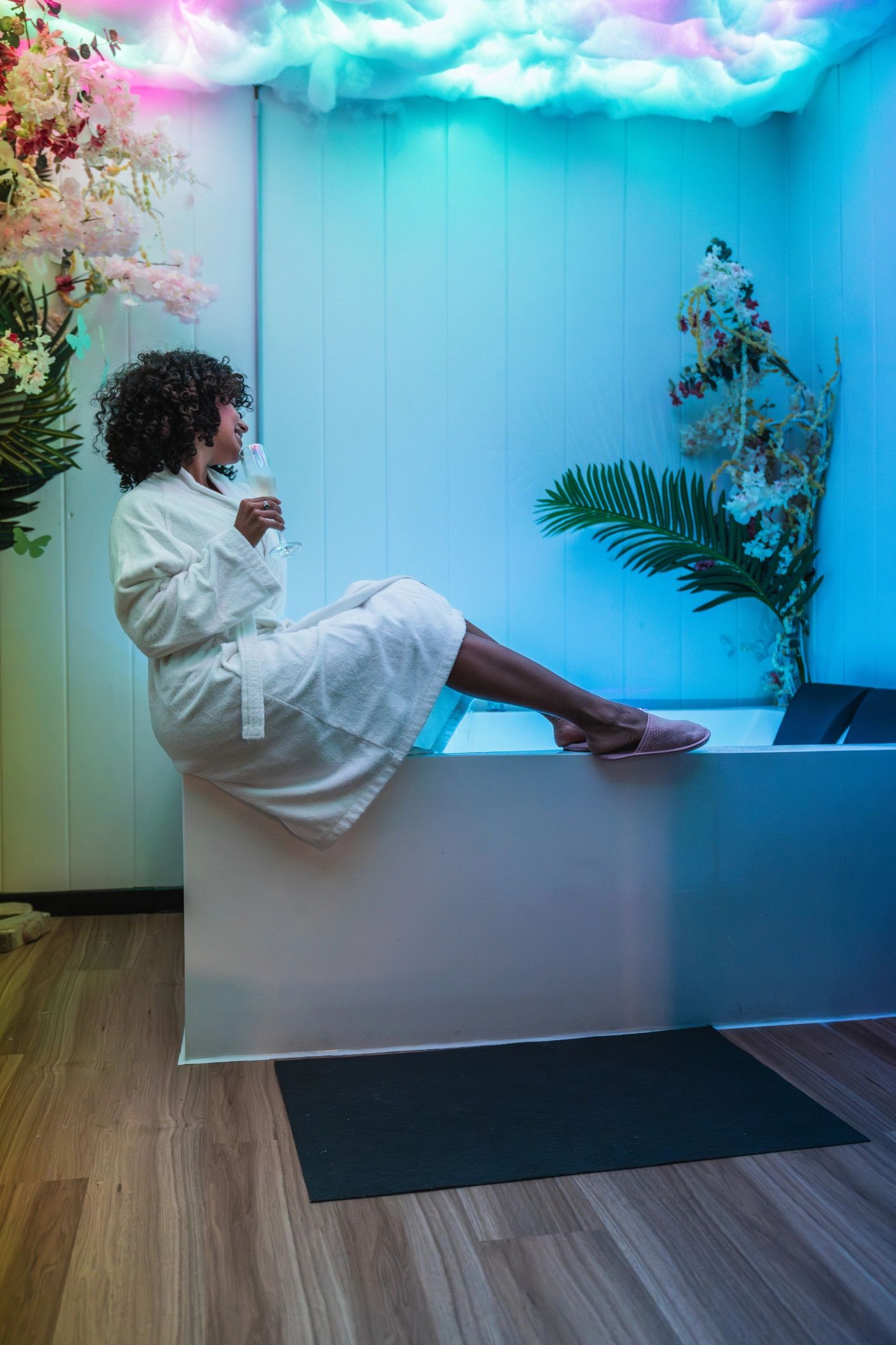 Client drinking infused water in a beauty spa